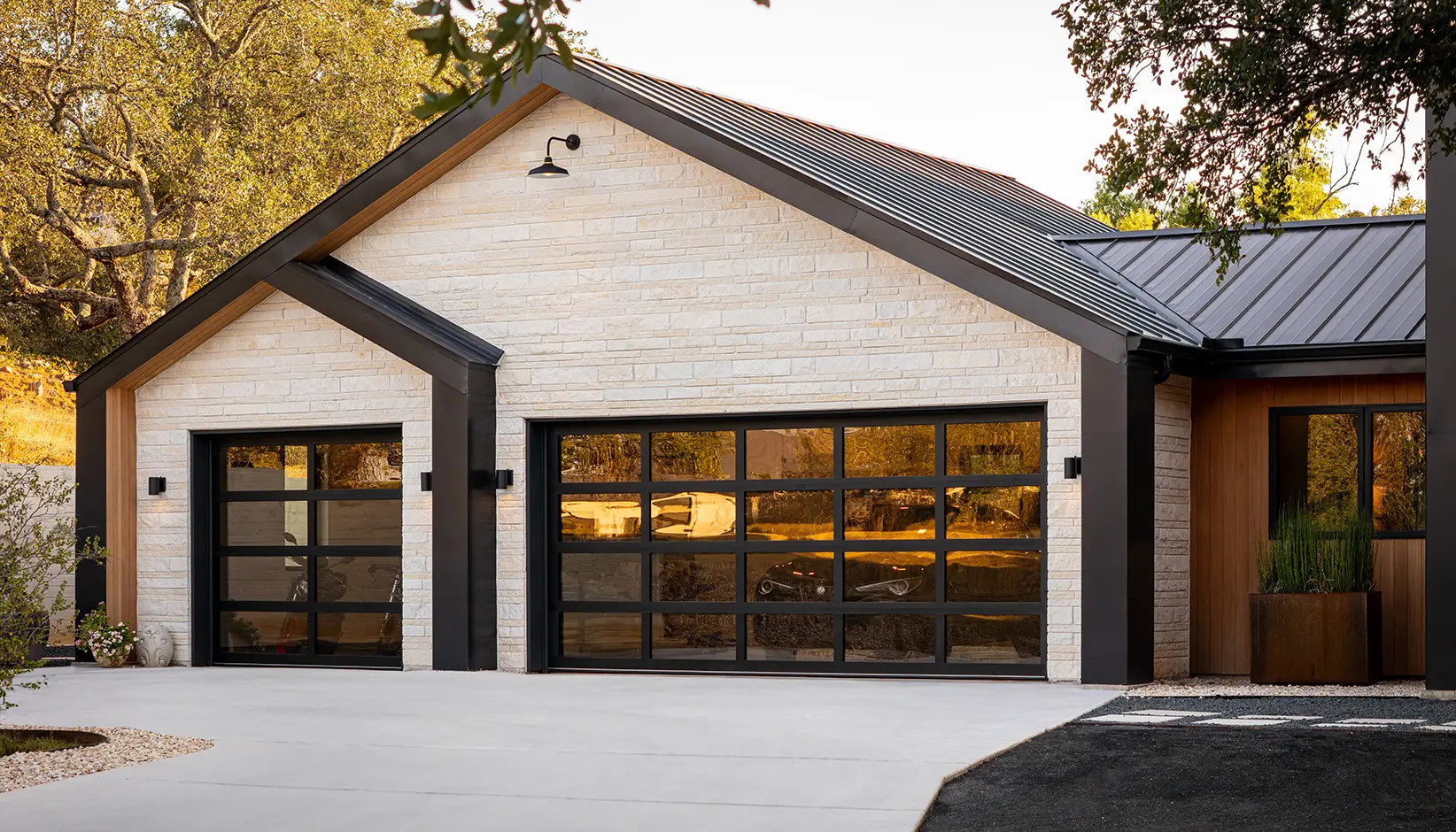 Clopay Avante aluminum and glass full-view garage door in Austin Bronze