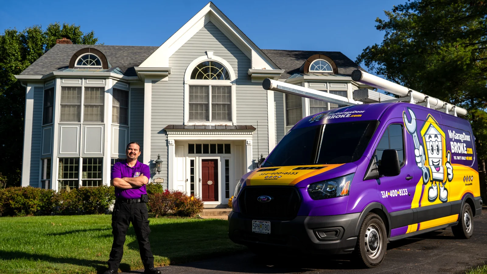 MyGarageDoorBROKE.com team with branded service truck